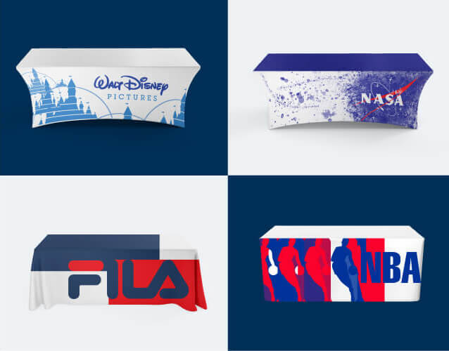 Four tables with custom tablecloths featuring NASA, Fila, Disney, and NBA logos and branding..