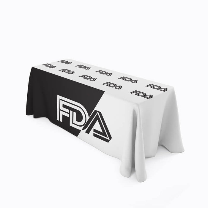 A custom table throw with FDA branding covering a table.